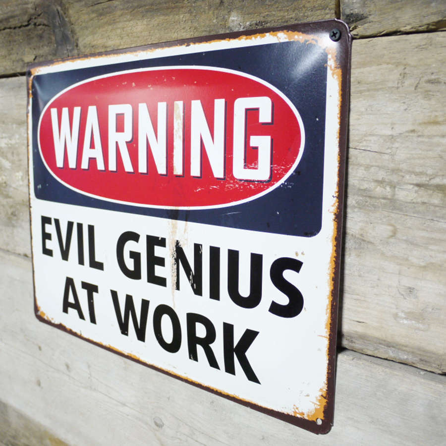 Metal wall hanging evil genius at work sign