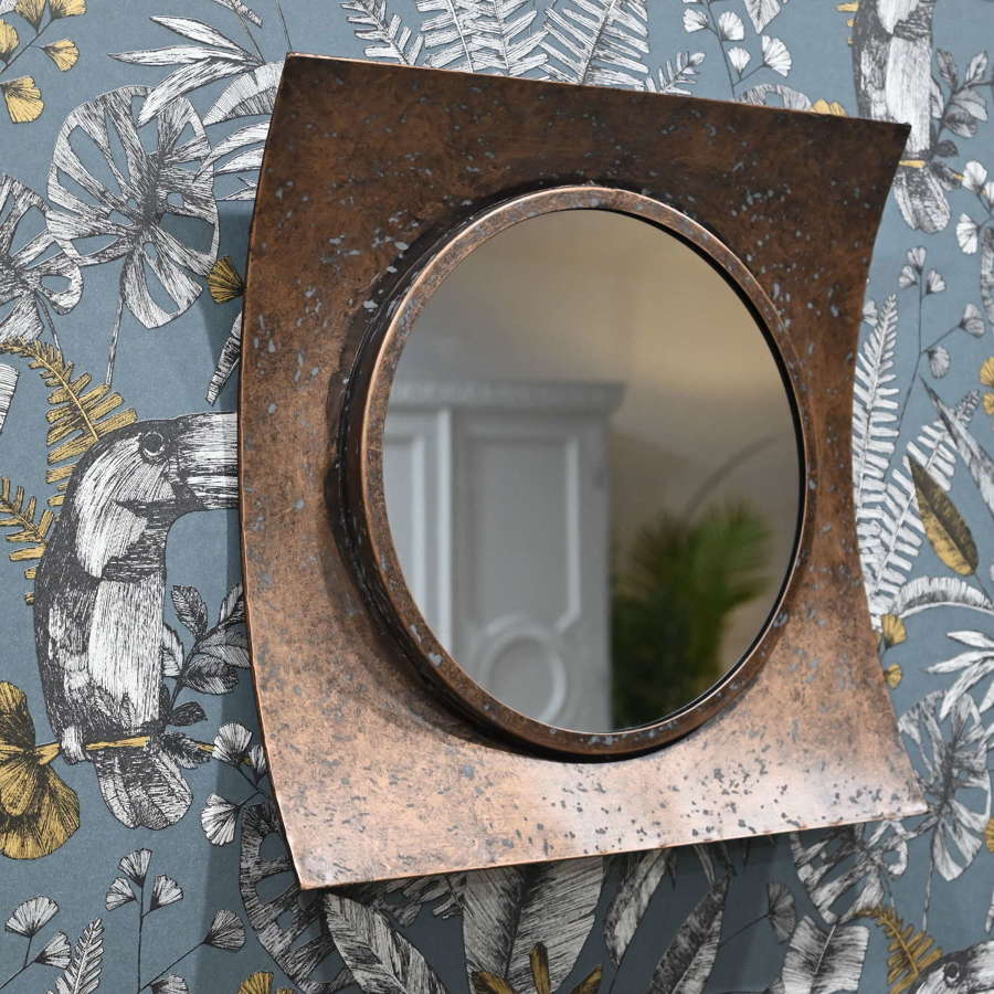 Rustic curved bronzed mirror