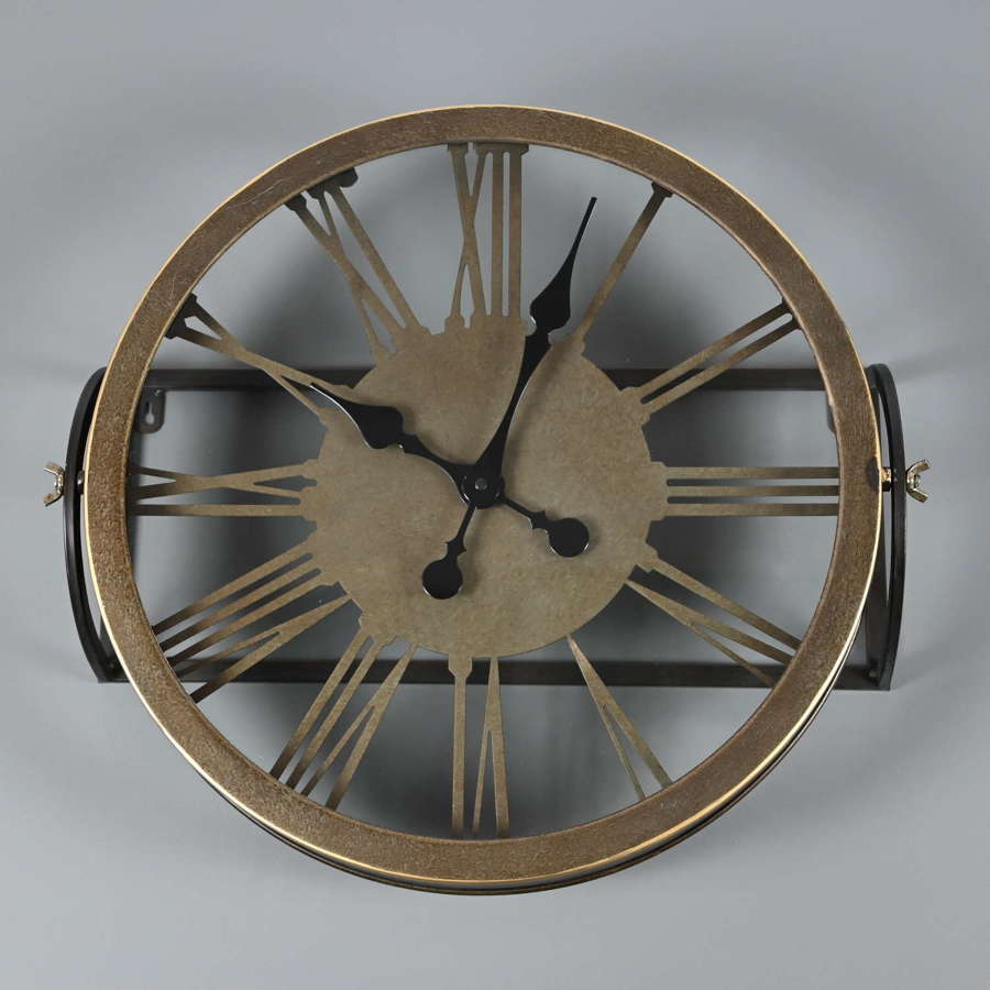Round metal wall mounted clock with a bronze finish