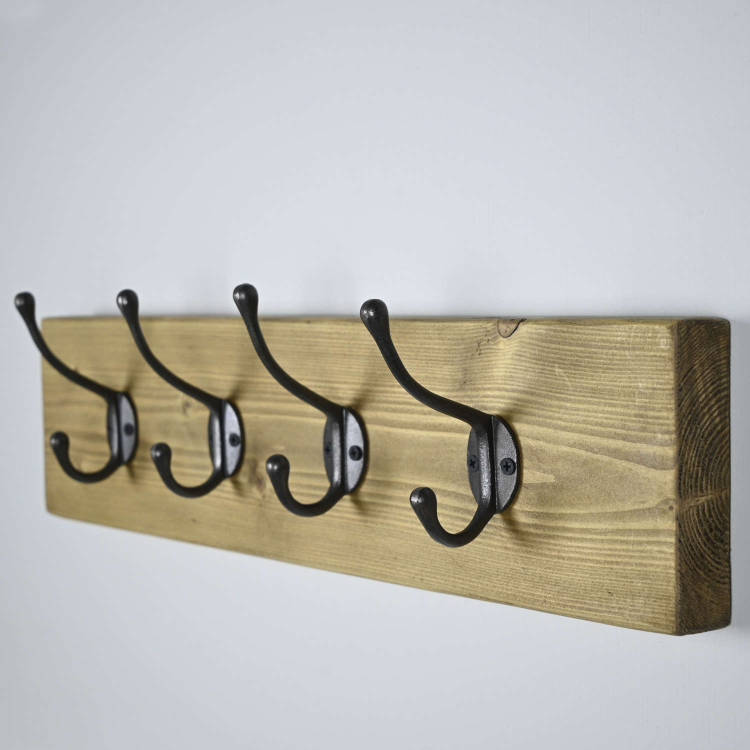 Rustic wall hanging coat rack with four cast Iron hooks