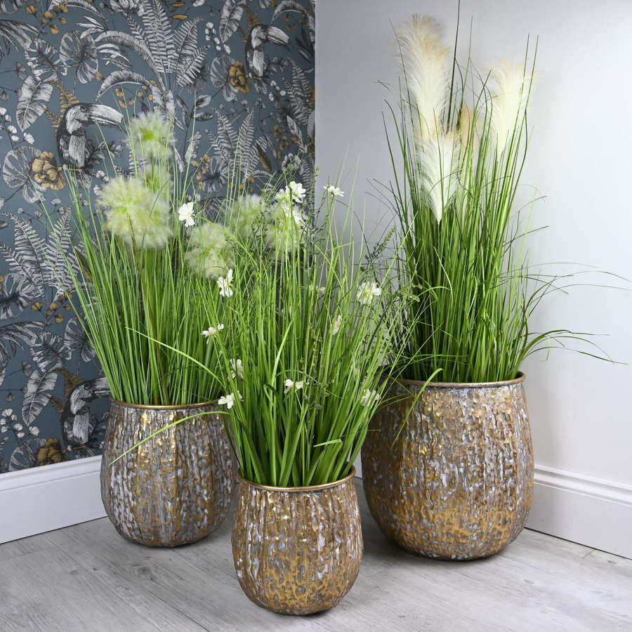 Gold Metal Planters in an antique finish.